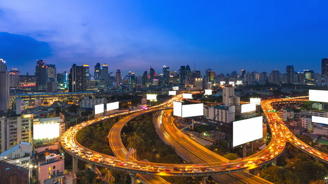Time Lapse Day To Night Cityscape And Many White Billboard Of Bangkok, Thailand (zoom in)