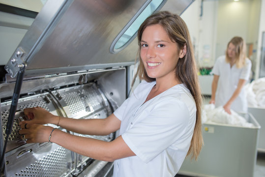 Lady working in industrial laundry