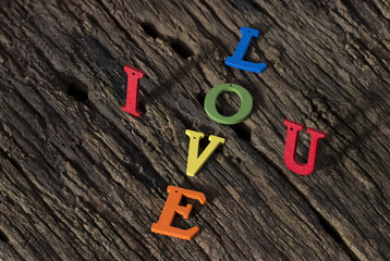 Valentines Day background.I love you alphabet wood on wood background.
