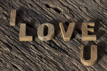 Valentines Day background.I love you alphabet wood on wood background.
