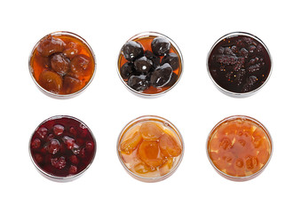 Collection of fruity jams isolated on white background