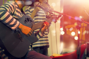 Guitarist on stage for background, soft and blur concept