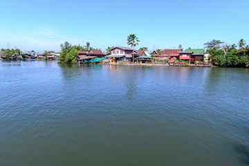 Fototapeta na wymiar Thai traditional house, village riverfront in Bangkok Thailand.