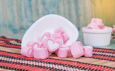 Colorful sweet marshmallow with sugar in a white-ware