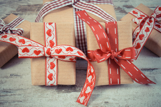 Vintage photo, Wrapped gifts in recycled paper for Valentines or other celebration