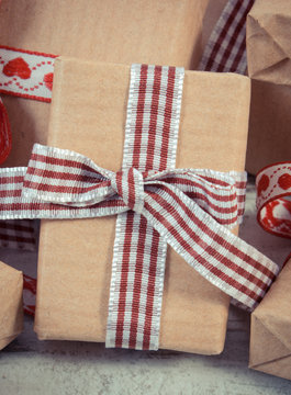 Vintage photo, Wrapped gifts in recycled paper for Valentines or other celebration