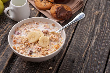 Bowl of oatmeal porridge with bananas