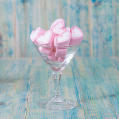Colorful sweet marshmallow  in  glasses on table