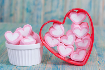 heart shaped candies on background,selective focus.