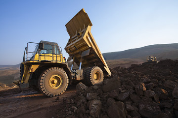 Dump truck unloading dirt