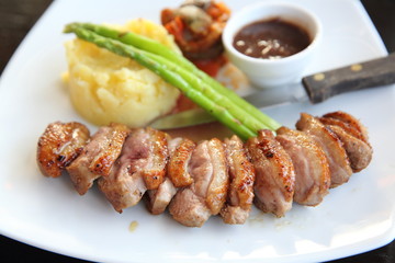 Appetizing Baked duck confit with potato and onions