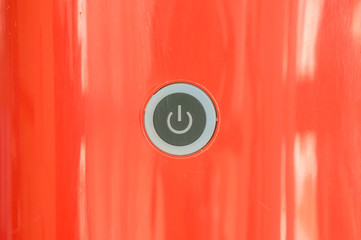 Closeup power button at red coffee machine background