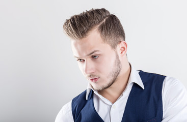Studio portrait of a fashion young man wearing a suit