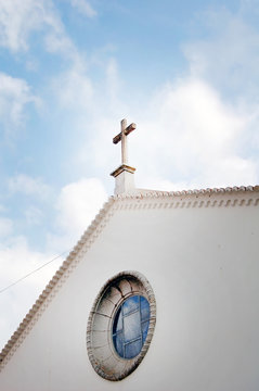 White Painted Church With Cross On The Roof