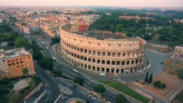 Colosseum, Rome, Italy. Aerial Roman Coliseum on sunrise. Beautiful view of the famous Italian landmark travel icon in the Roman forum.