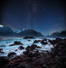 stars shine in the sky over the fjords