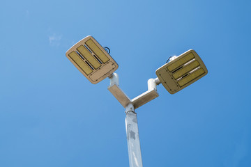 LED street lamps post on blue sky background