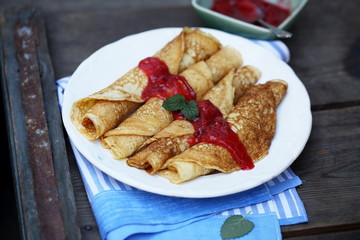 Pancakes with berry jam and mint