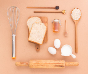 Baking Equipment make Bread wheat grains and cereals on wooden b