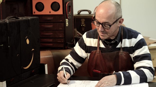 Trunk Maker at work in his luxury leather workshop