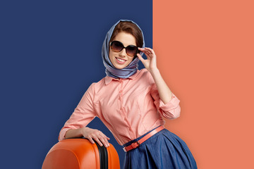 Fashion woman in sunglasses and scarf. 