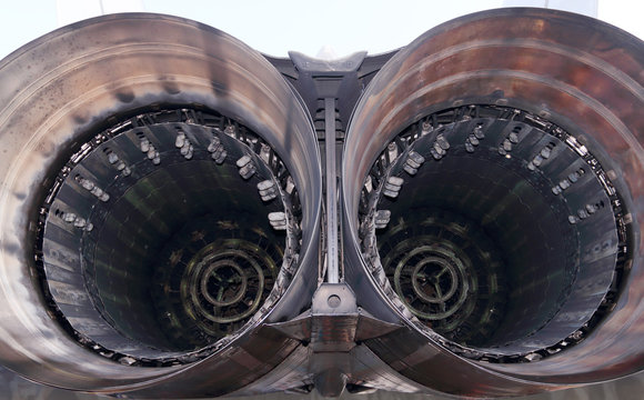 Close up view of big round nozzle of modern military aircraft