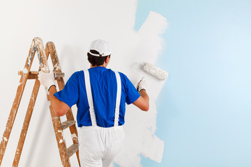painter painting with paint roller - 101697533