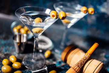Martini, classic cocktail with olives, vodka and gin served cold in a restaurant