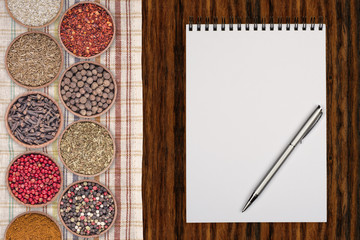 Copyspace food frame with notepad paper spices and cooking acces