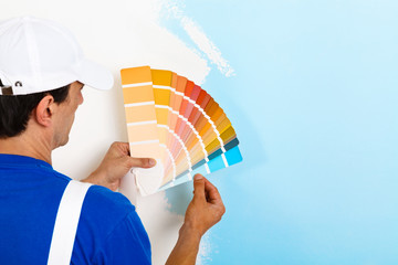 painter man looking a color palette - 101699957