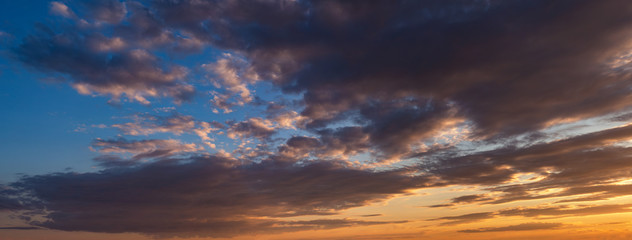 Naklejka na ściany i meble Sunset sky with clouds. Panorama.
