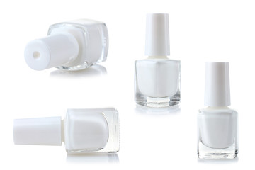 Nail Polish located on a white isolated background.A collage of four glass bottles of white lacquer