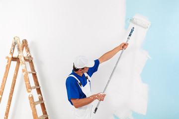 painter painting with paint roller - 101703728