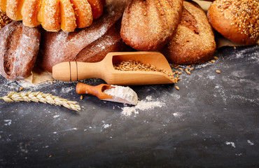 Different bread on a rustic dark background 