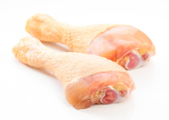 raw chicken drumsticks isolated on white