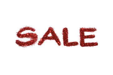 Word Sale of red glitter sparkle on white background