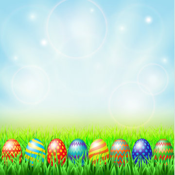 Easter eggs, green sunny meadow