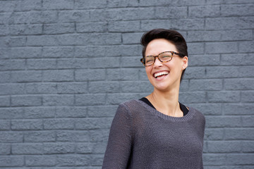 Beautiful mixed race woman laughing with glasses