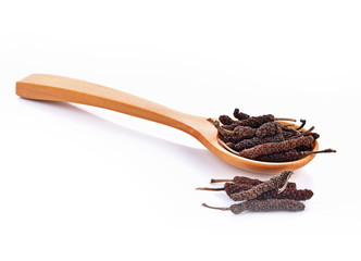 Long Pepper dry in spoon on white background