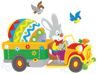 Obraz na płótnie Canvas Easter Bunny driving a truck with a big colorfully painted egg