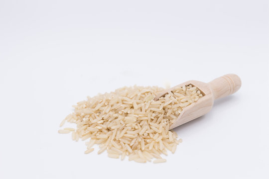 brown rice grain in a gunny bag on white background