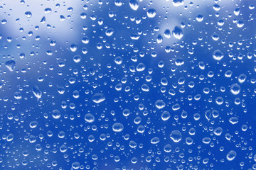 Naklejka na ściany i meble rain drops on glass window.