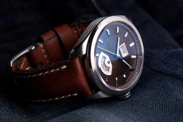 Wrist watch with brown dial on brown leather strap