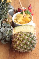 Pineapple sweet fruit delicious on wood background.