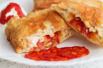 Panzerotti with kulen, ketchup and mayonnaise.