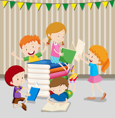 Children reading books in classroom