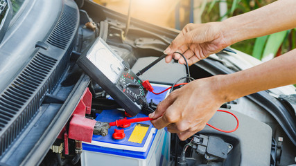 Checking power of battery by meter, maintenance car by yoursalf