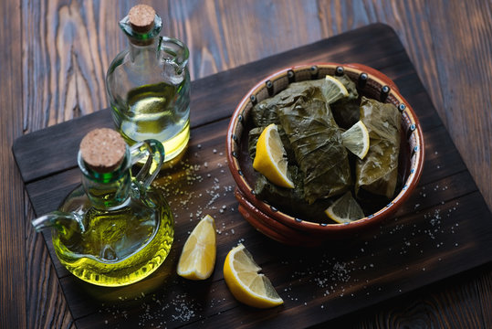 Eastern traditional dolma served with lemon, selective focus