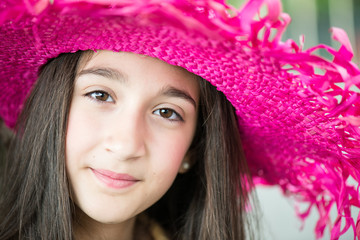 portrait of little girl with hat and long hair