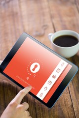 Composite image of woman using tablet pc